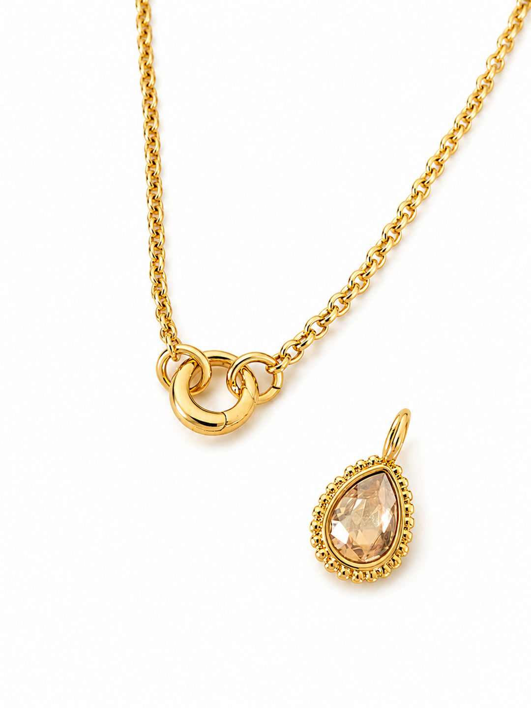 Gold-plated necklace with detachable amber-colored teardrop pendant