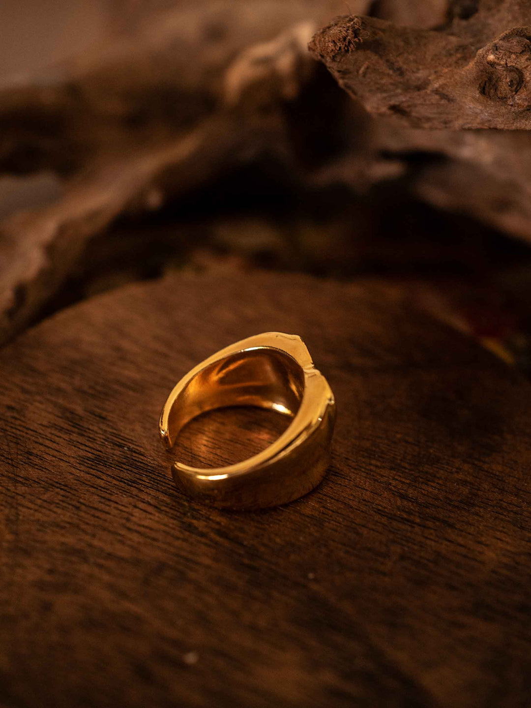 A gold ring with love hearts in cold enamel