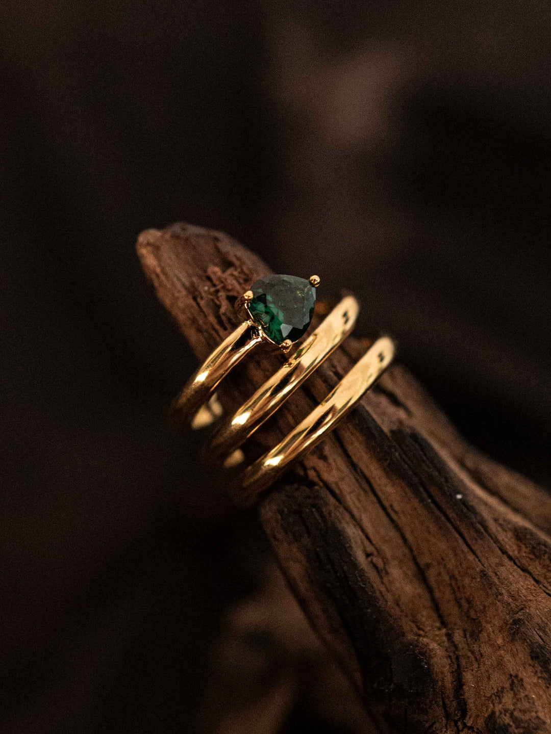 A ring with multiple layers of green hearts