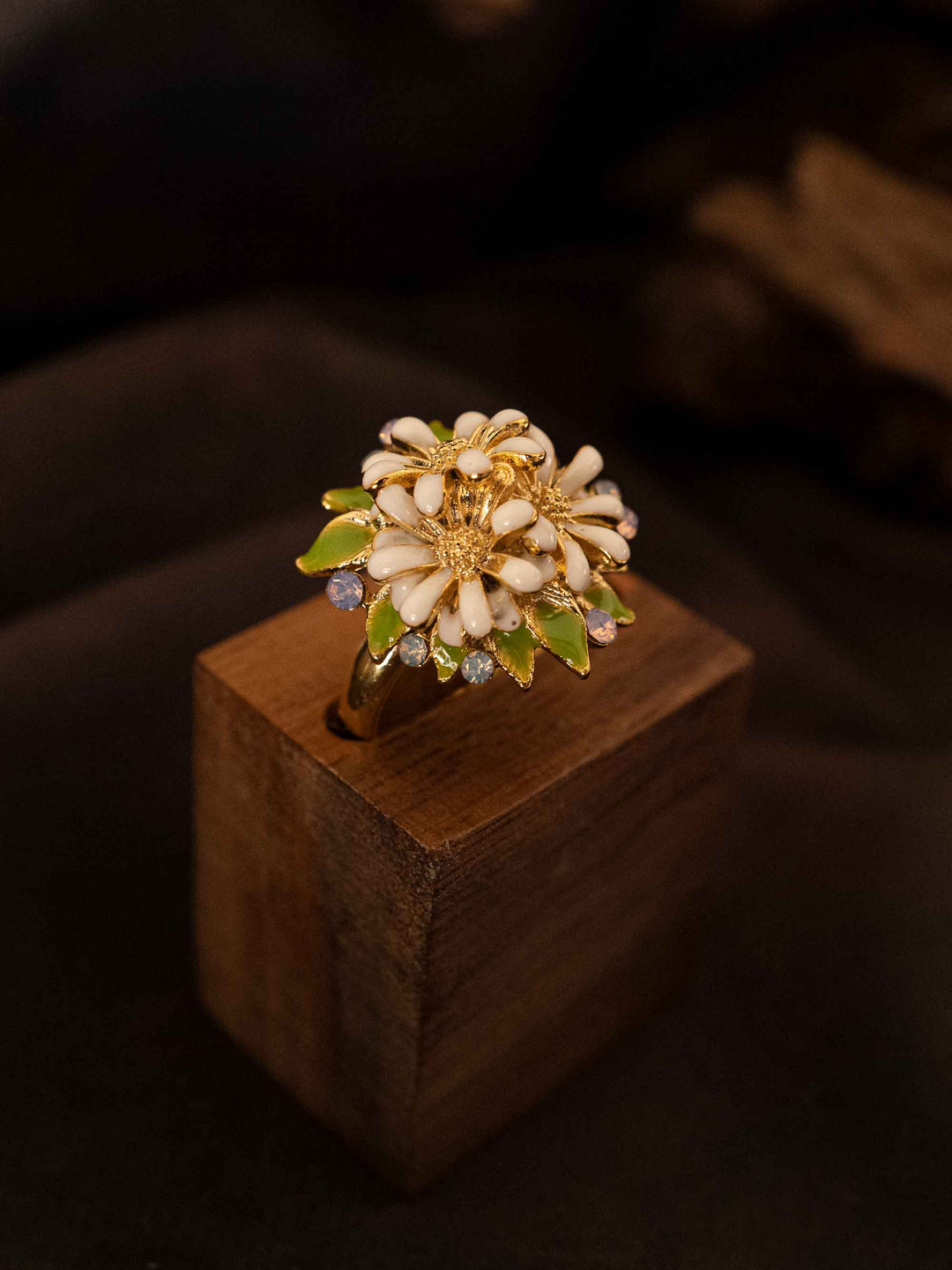 A cold enamel white flower ring