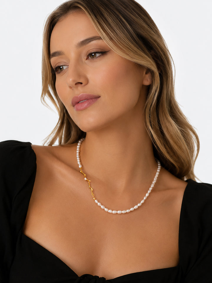 Freshwater pearl necklace with gold branch detail on model