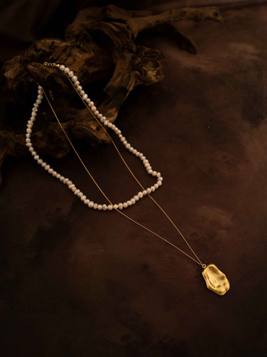 A double layer pearl plated 18k gold necklace