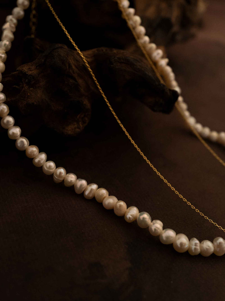 A double layer pearl plated 18k gold necklace