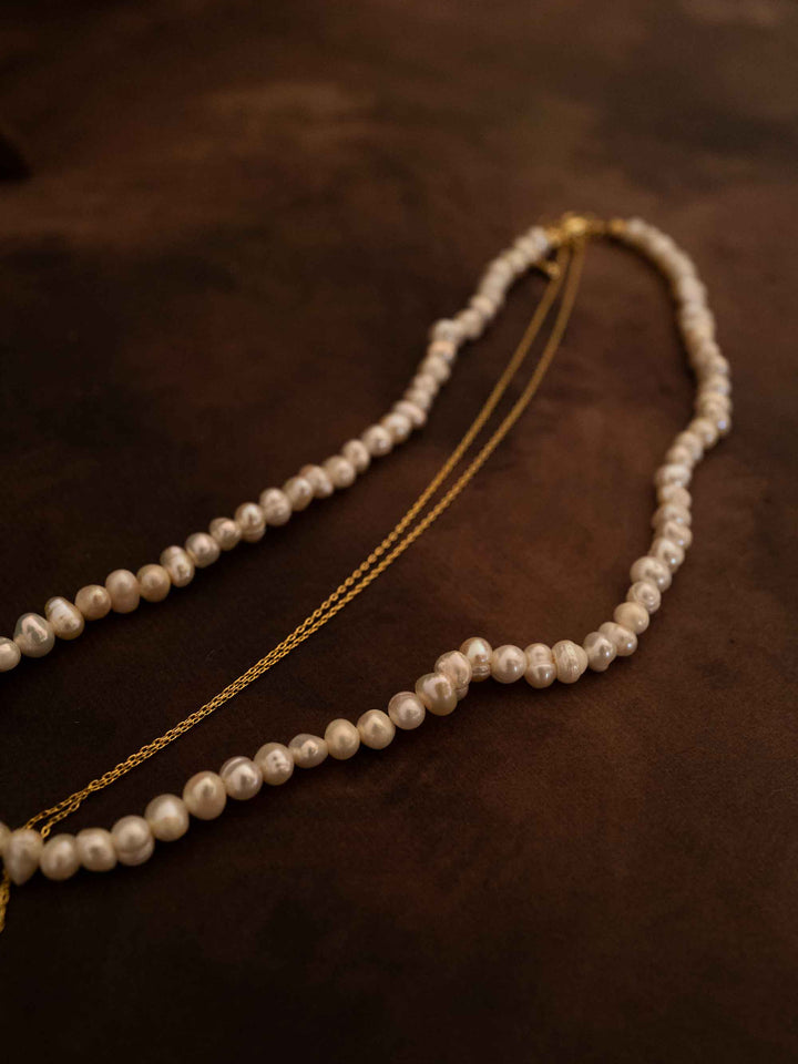 A double layer pearl plated 18k gold necklace