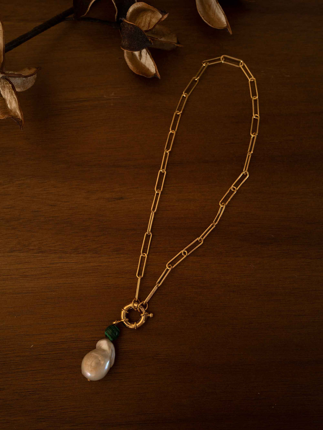 A gold necklace with baroque pearls and malachite