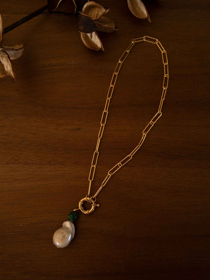 A gold necklace with baroque pearls and malachite