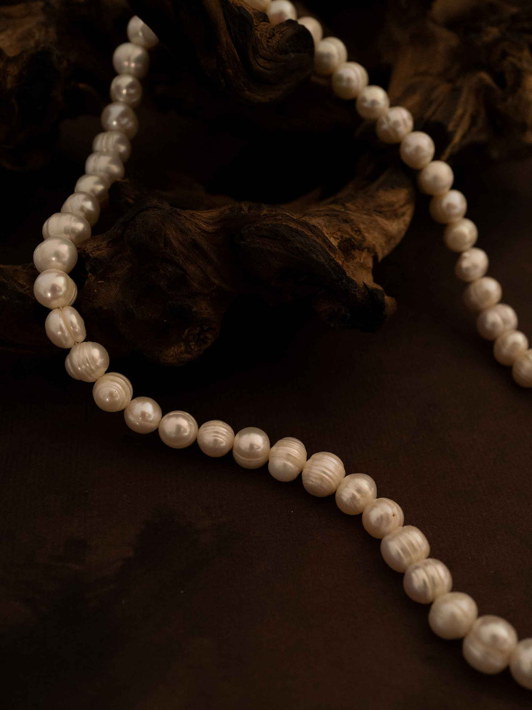 A pearl necklace with square zirconia