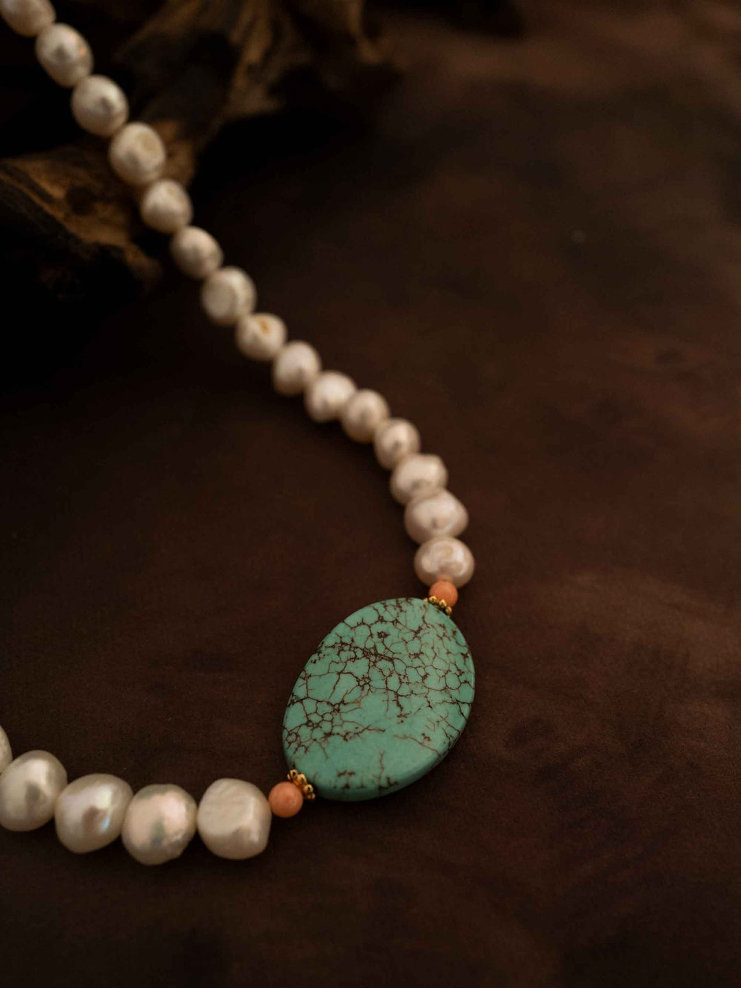A necklace of natural stones and pearls