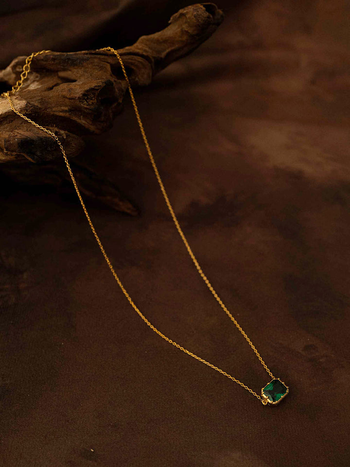 A green crystal gold necklace