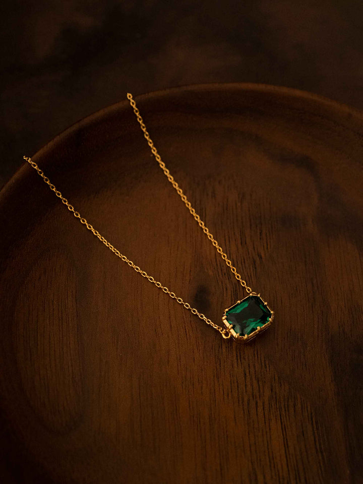 A green crystal gold necklace