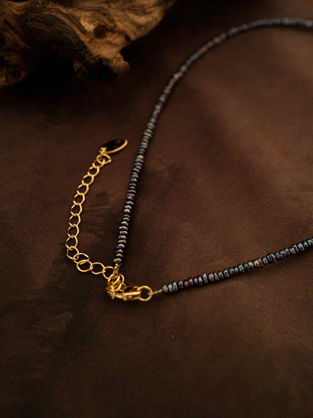 A necklace handmade from abalone shells and natural stones