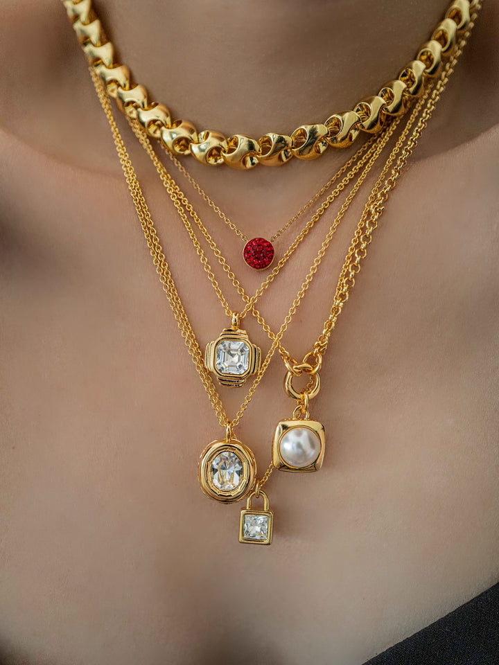 a model wears necklaces