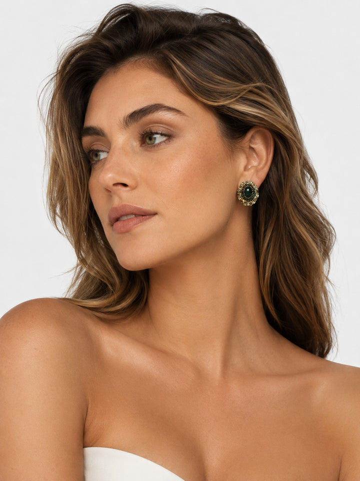Farrah vintage-inspired green crystal earrings worn on the ear