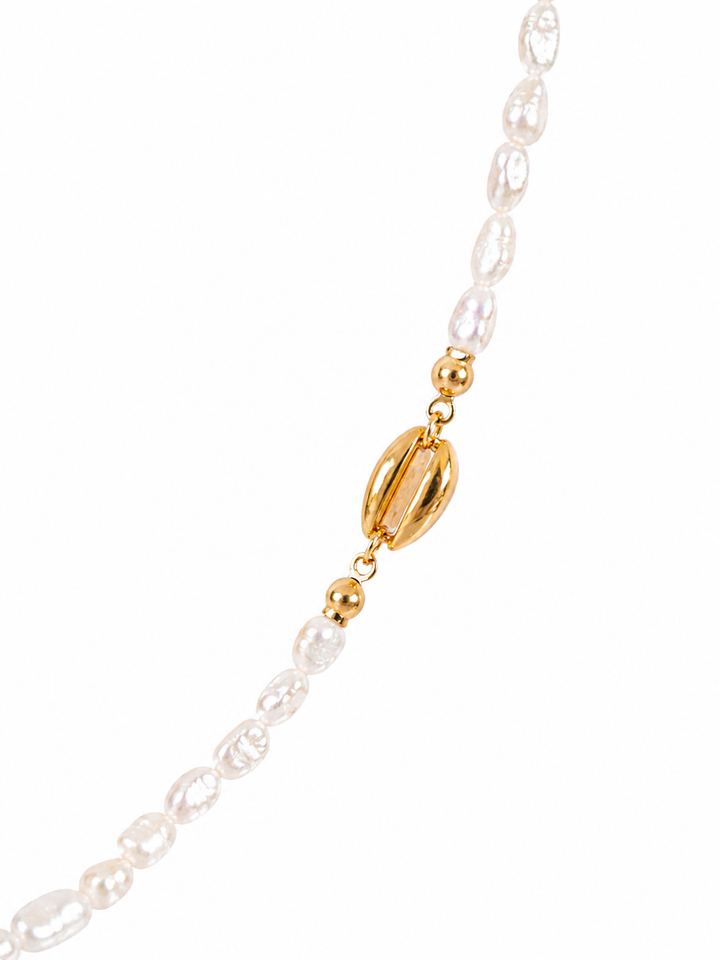 Gold-plated shell charm detail on pearl necklace