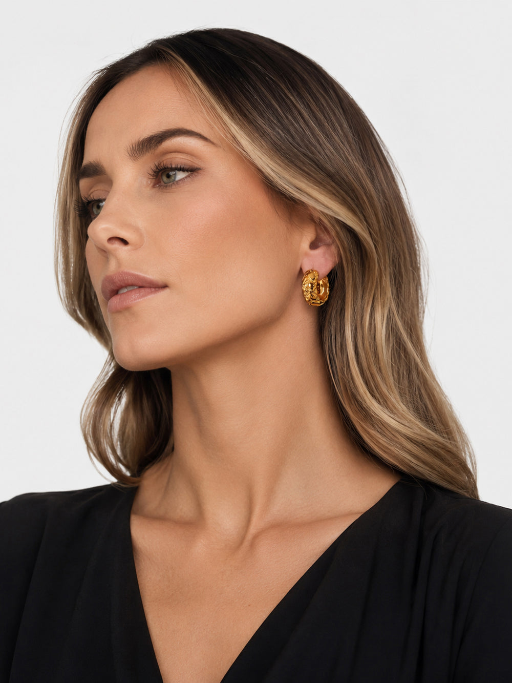 Herminia braided hoop earrings styled on model