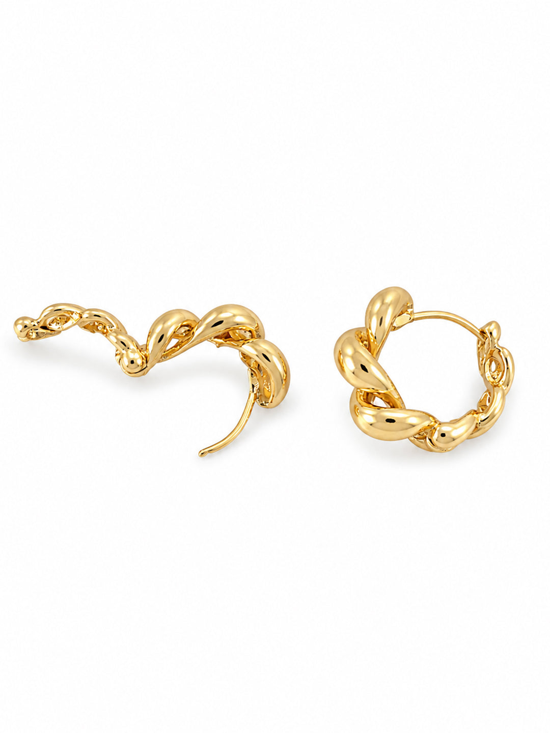 Gold-plated hoop earrings on red satin