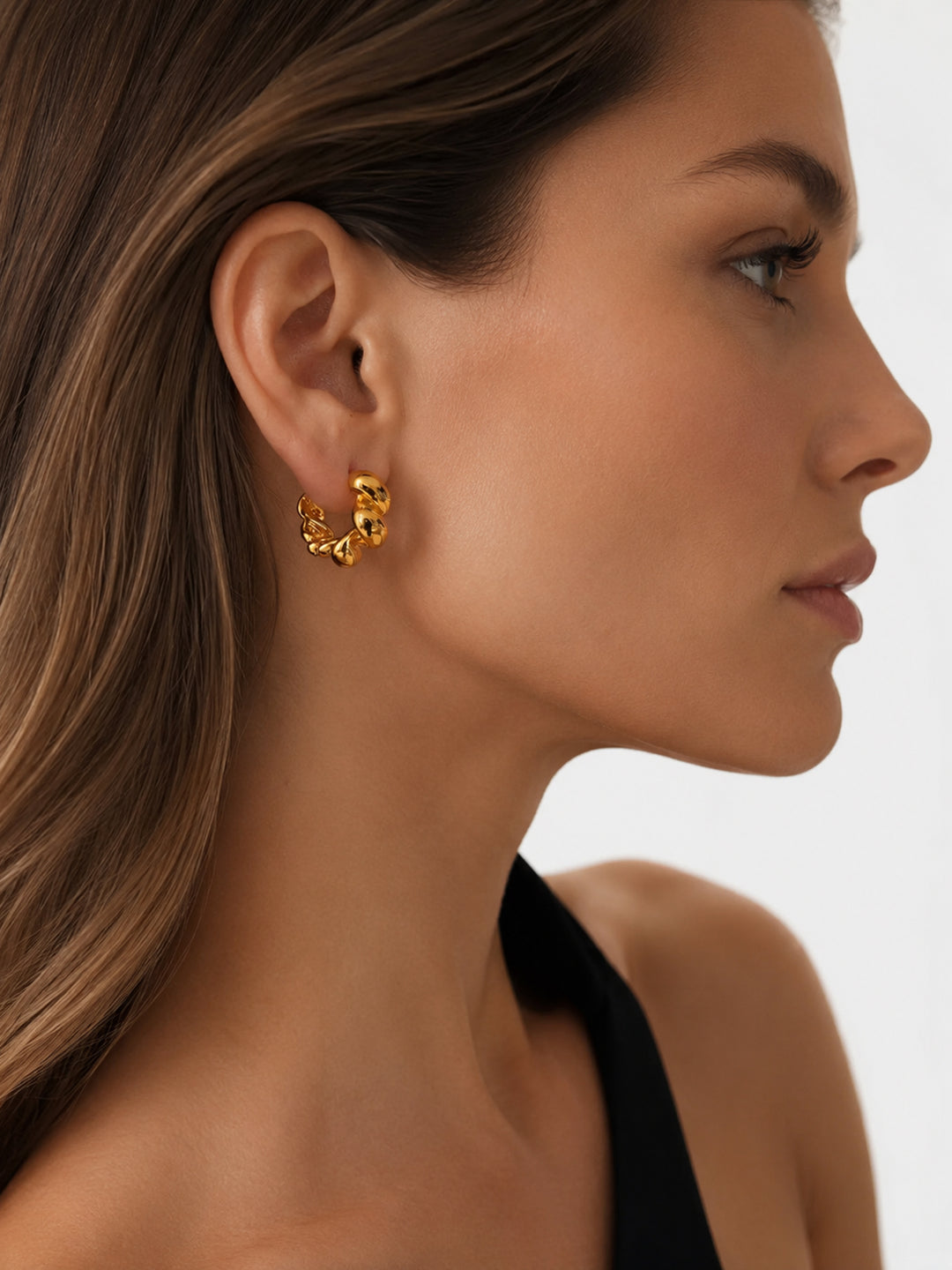 Jane textured hoop earrings styled on model