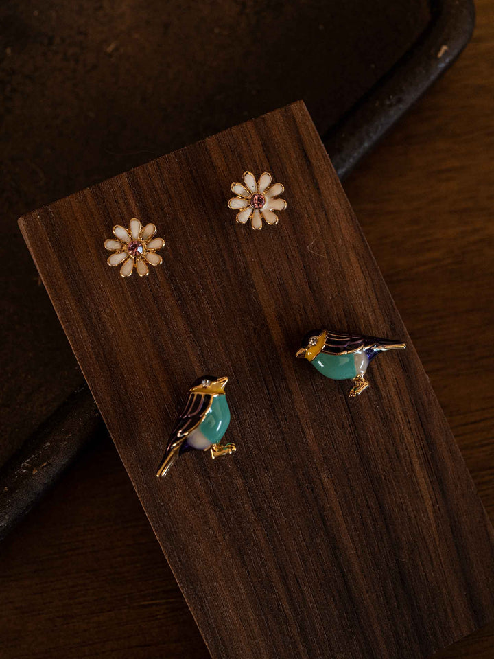 A bird and flower set of earrings