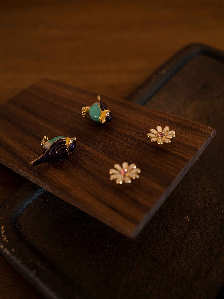A bird and flower set of earrings