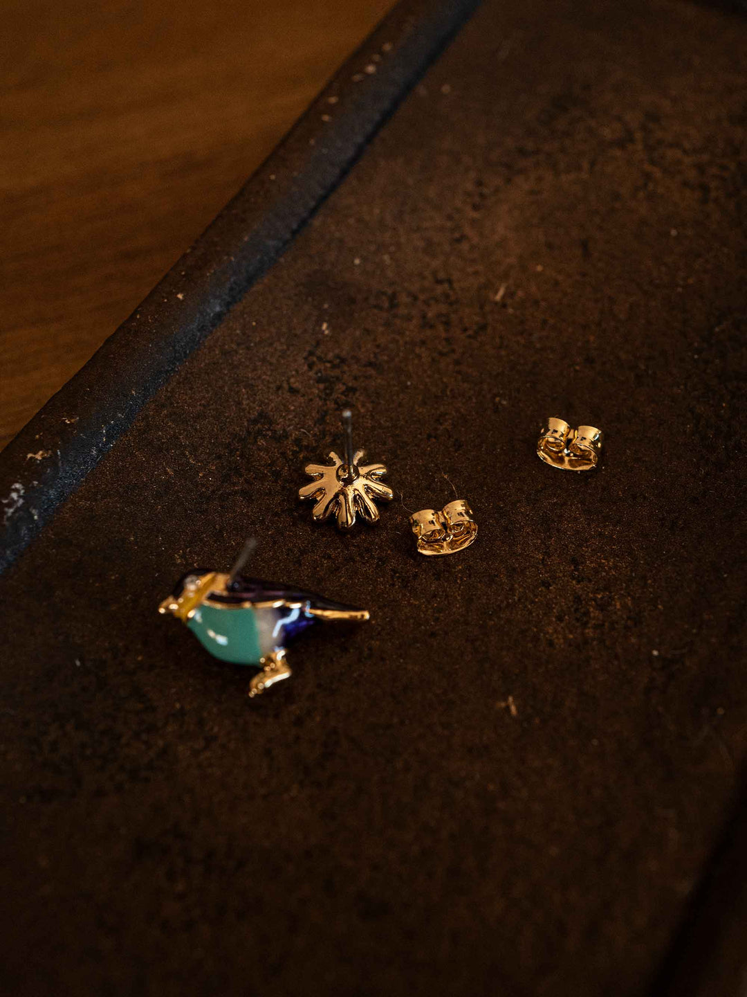 A bird and flower set of earrings