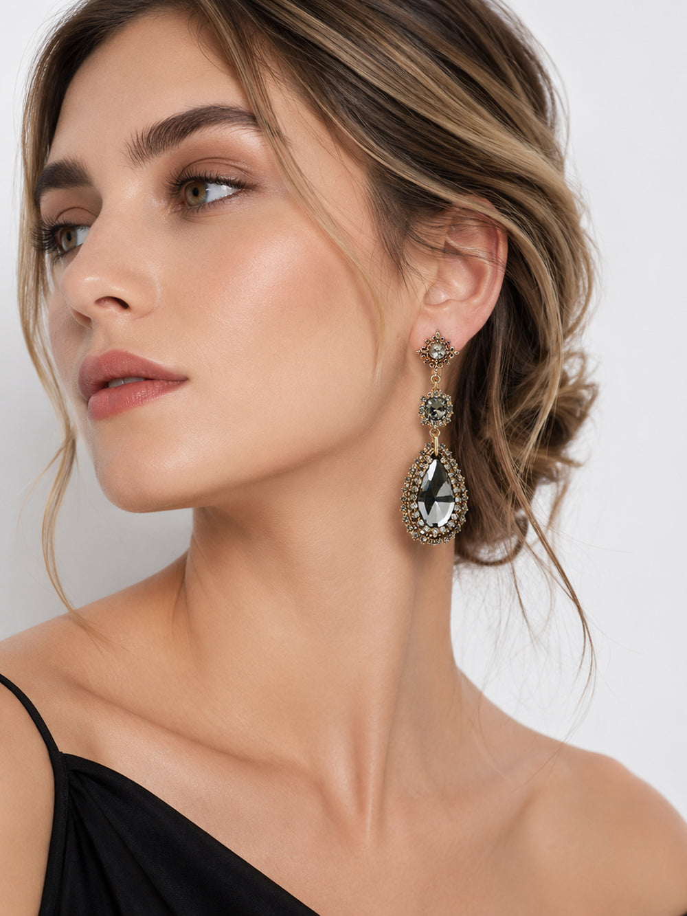 Justine crystal teardrop statement earrings on model