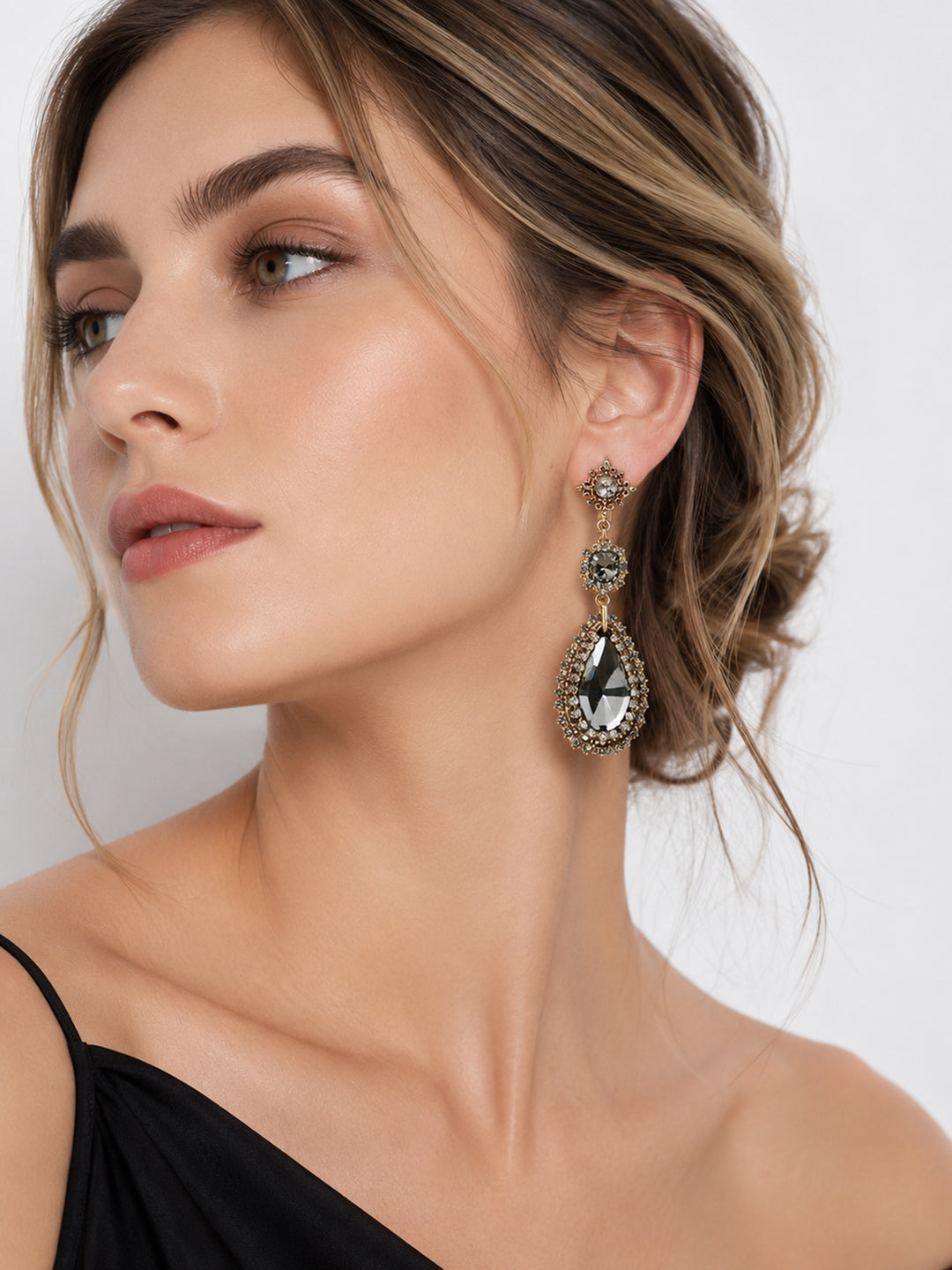 Justine crystal teardrop statement earrings on model