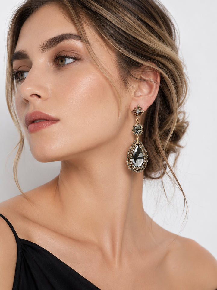 Justine crystal teardrop statement earrings on model