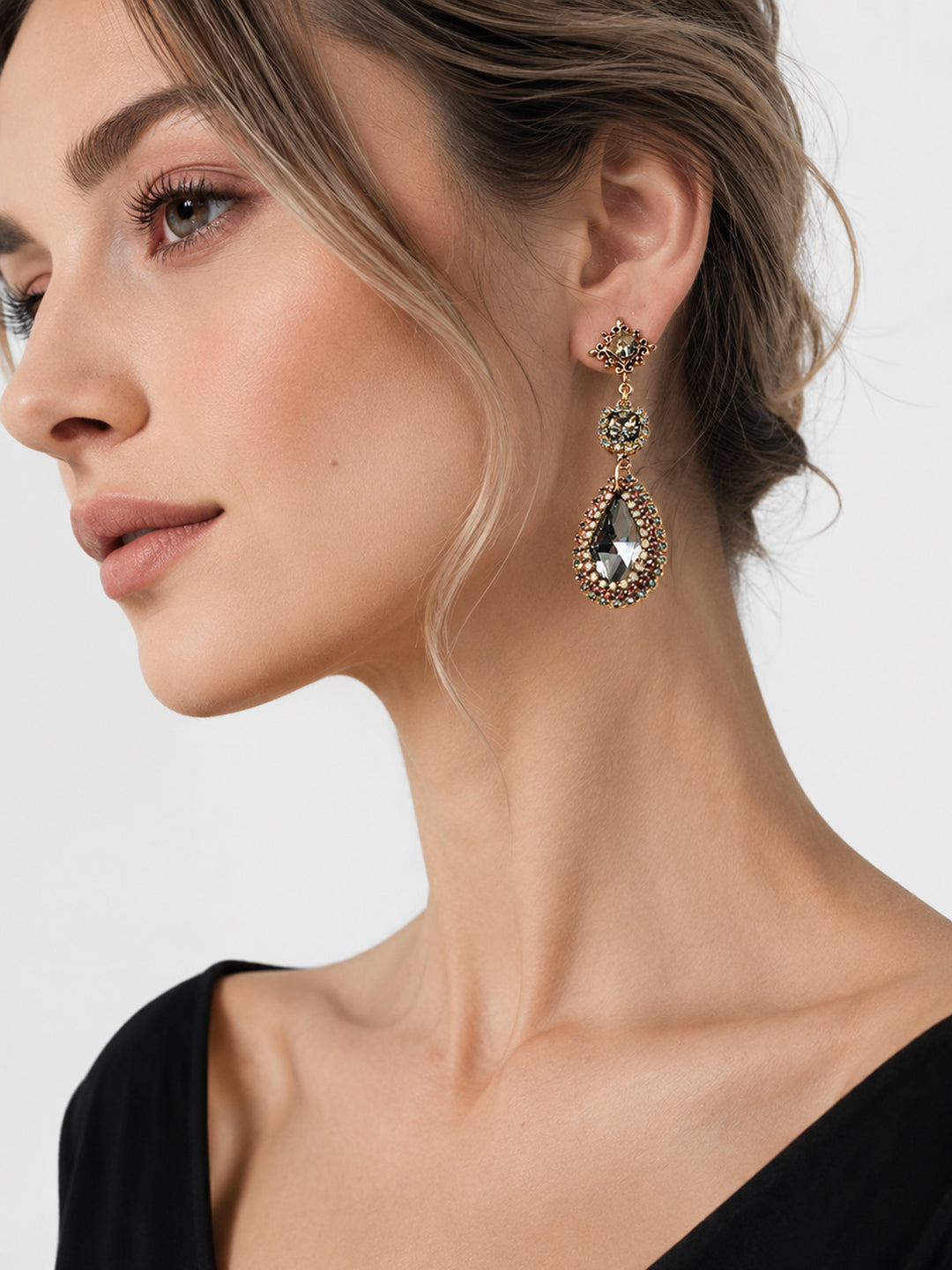 Long crystal drop earrings styled for special occasion look