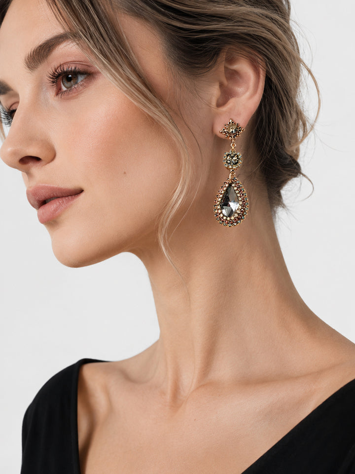 Long crystal drop earrings styled for special occasion look