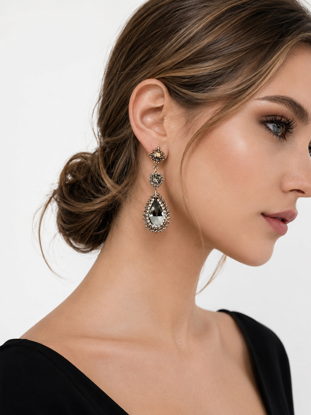 Justine crystal statement earrings worn with black evening outfit