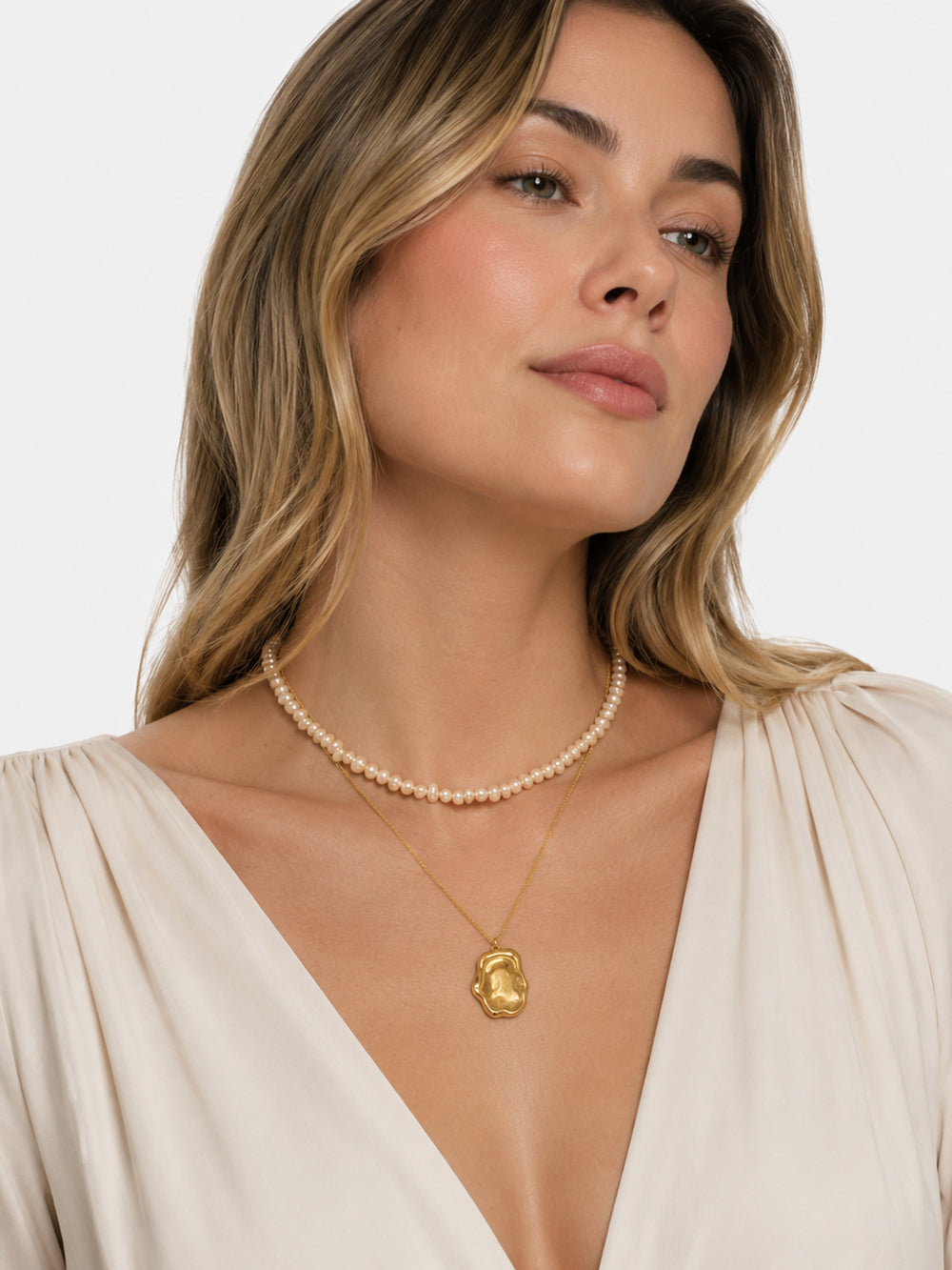 Layered freshwater pearl necklace styled on model