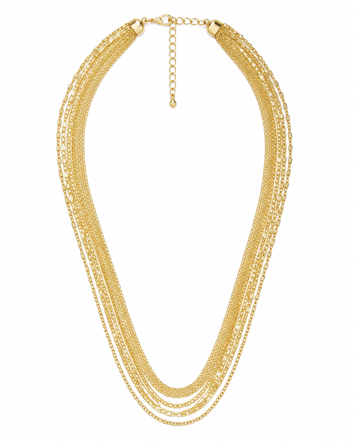 Natalia layered gold chain necklace on red satin