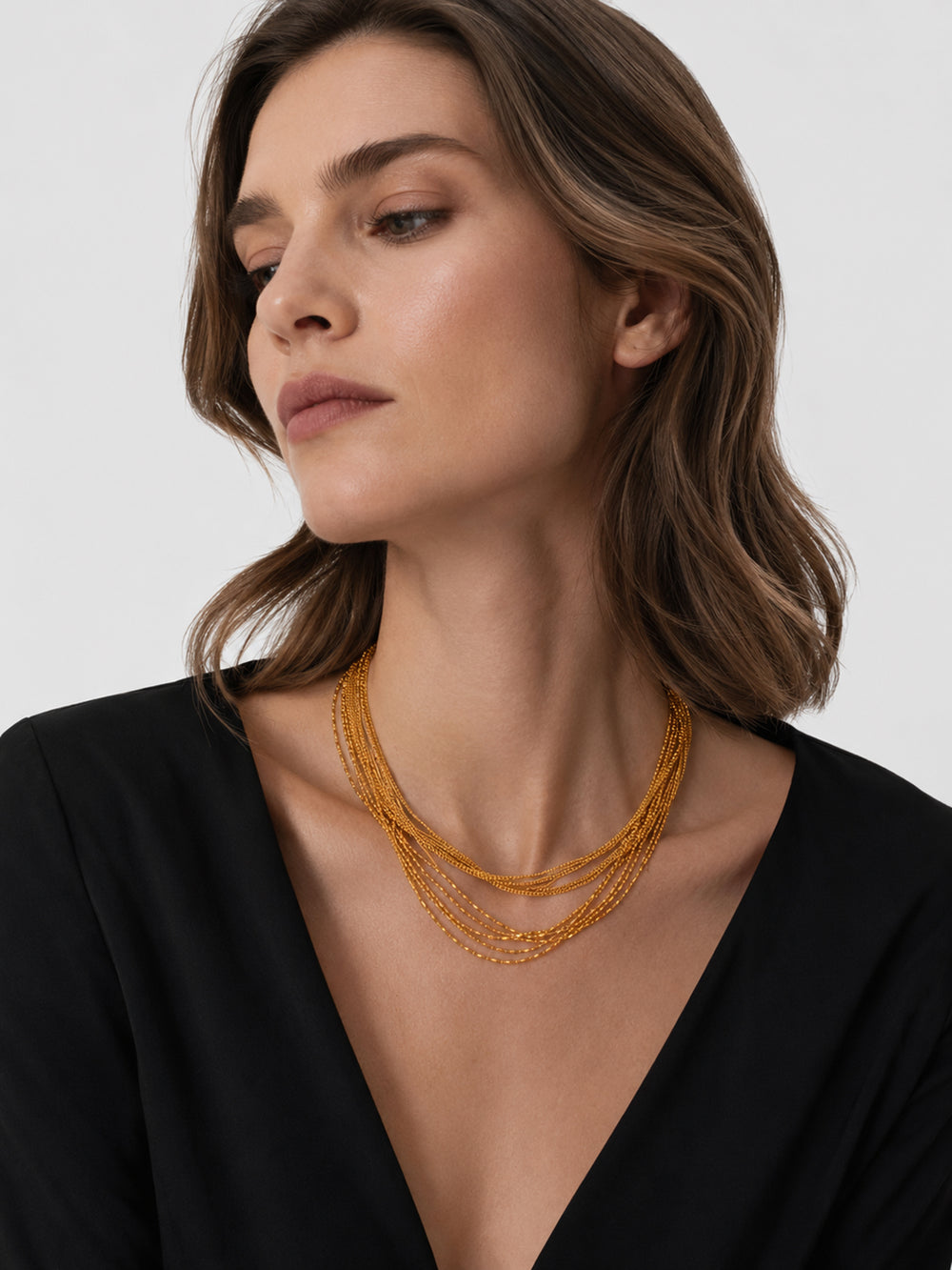 Natalia gold layered necklace styled on model
