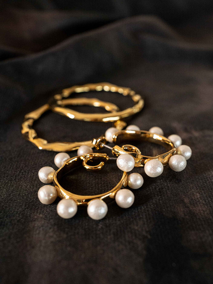 A gold hoop earring that can be worn as a detachable piece.