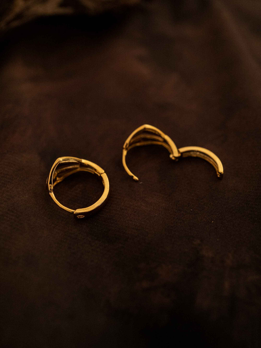 One gold hoop earring