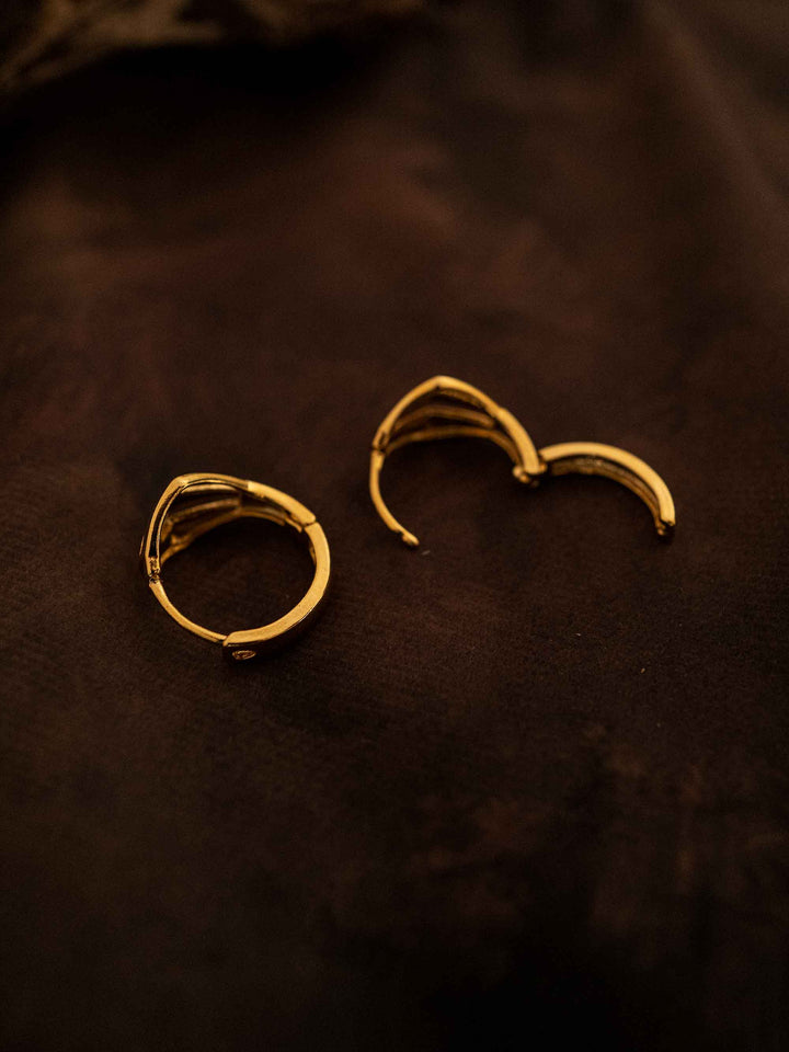 One gold hoop earring
