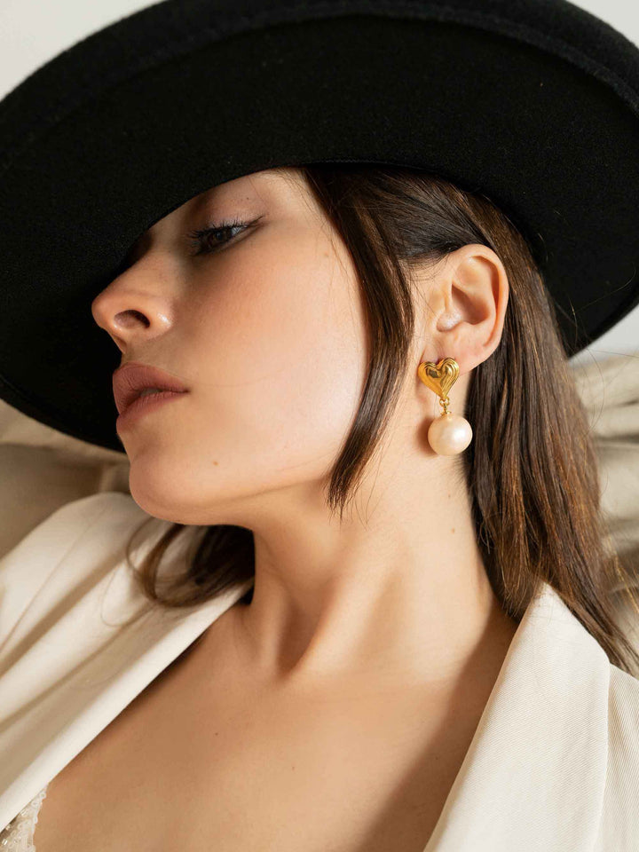 model wears Cotton Pearl Heart Earrings