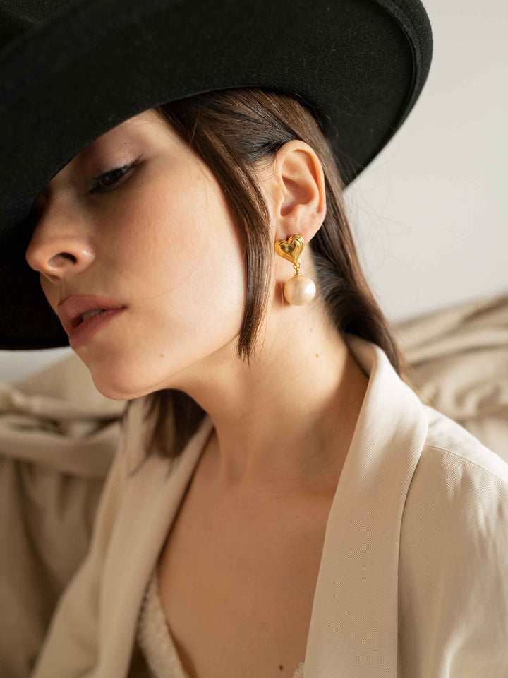 model wears Cotton Pearl Heart Earrings