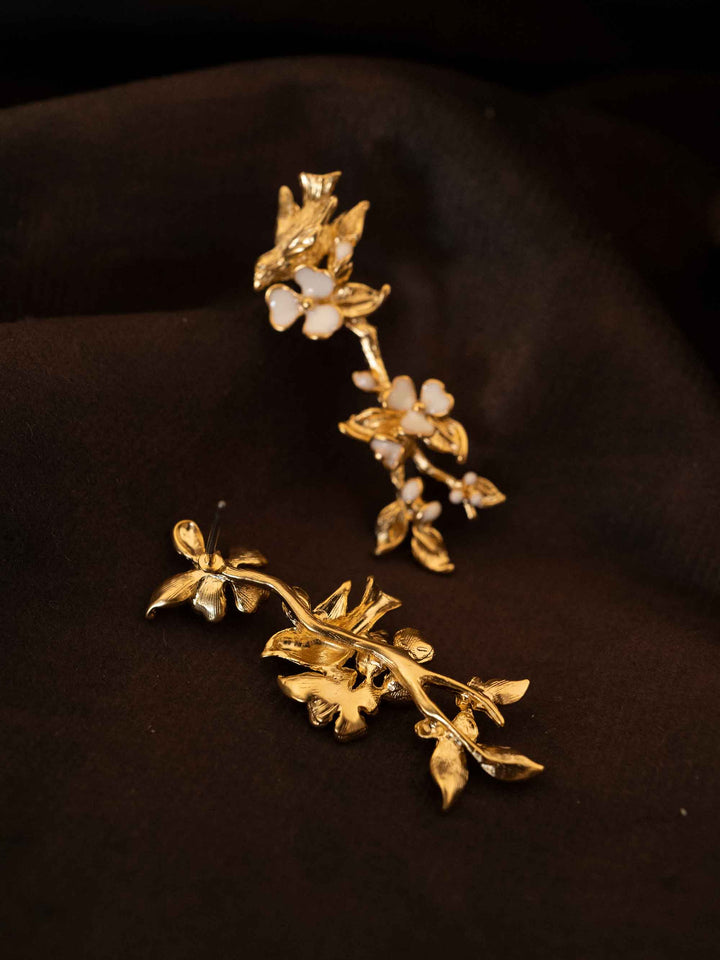 One long gold floral earring
