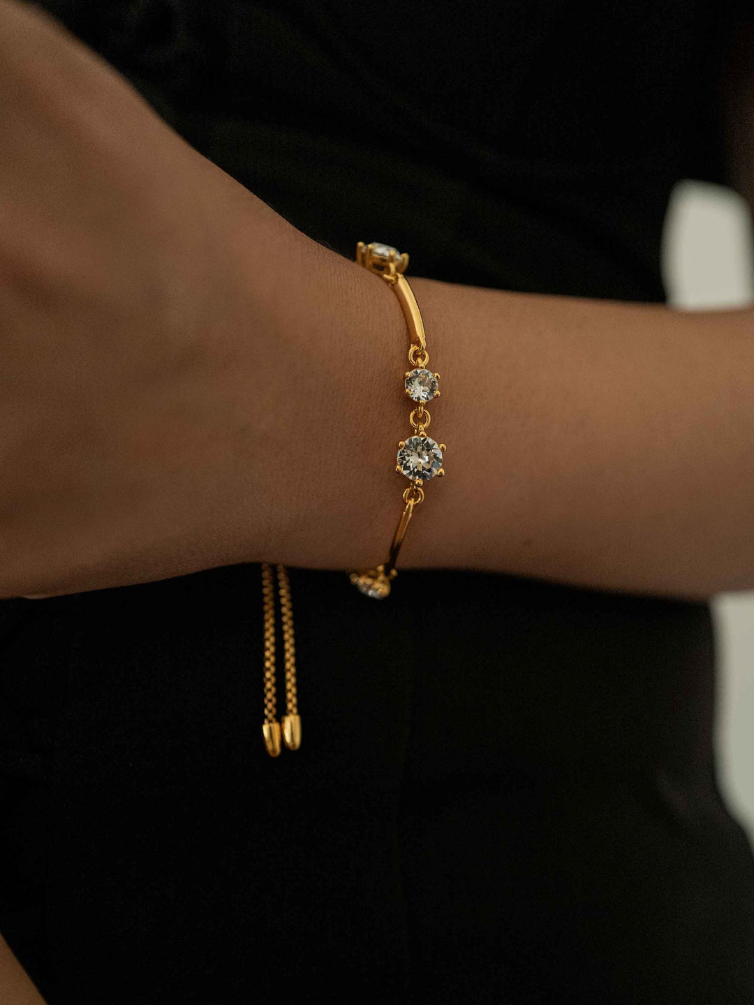 A gold bracelet with zirconia