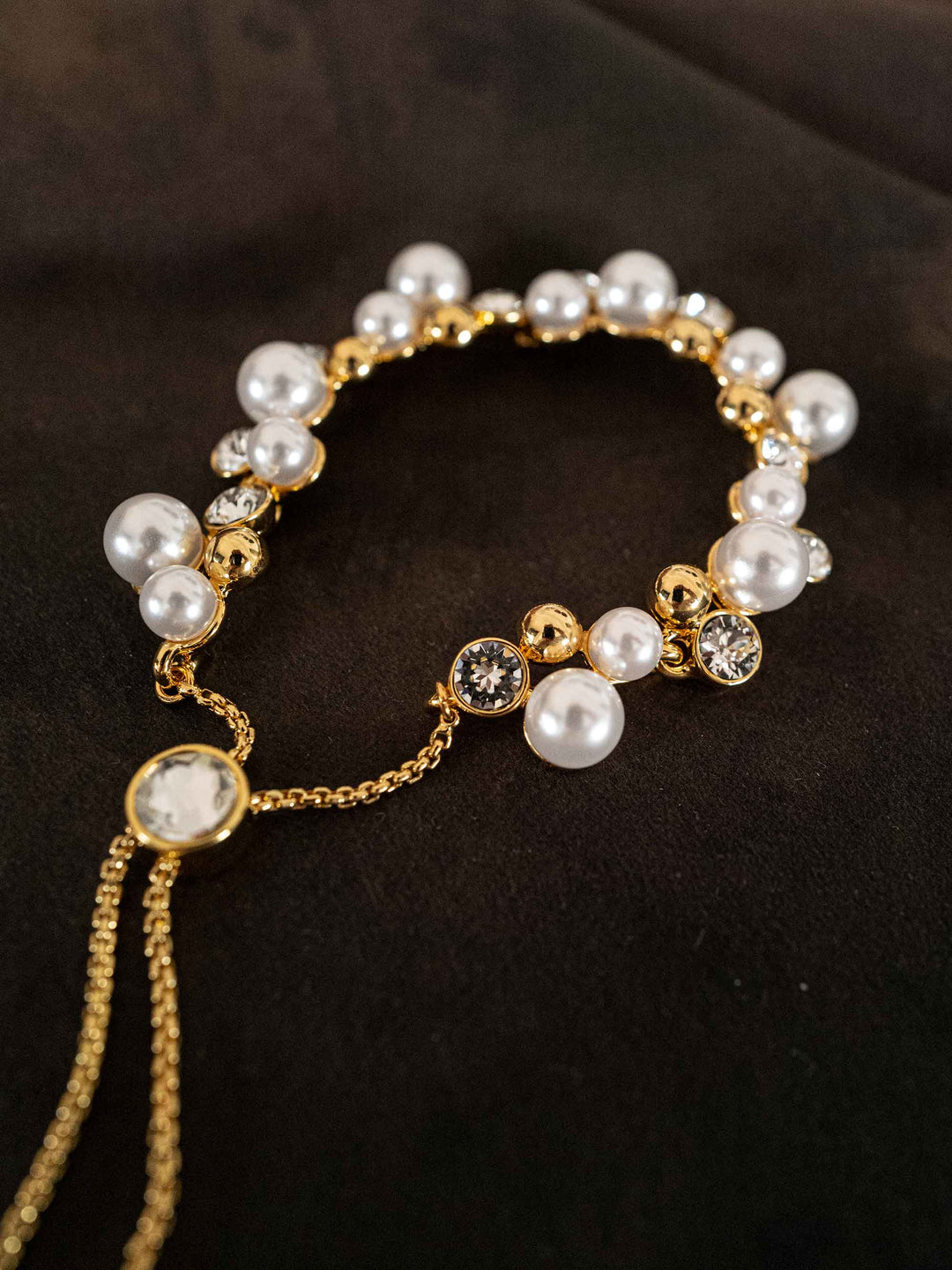 A bracelet of pearls and glass crystals