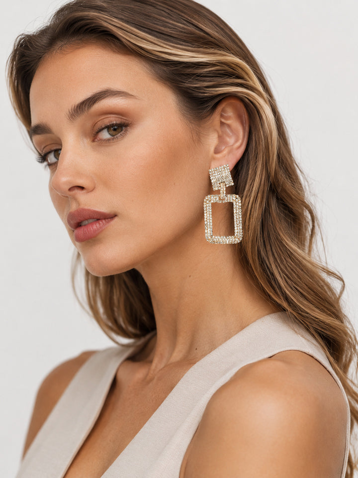 Shiloh crystal drop earrings styled on model