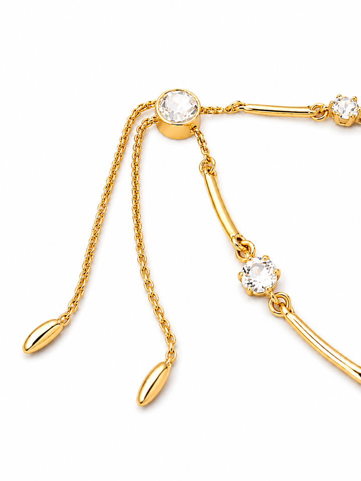 Gold-plated crystal bracelet worn with black outfit