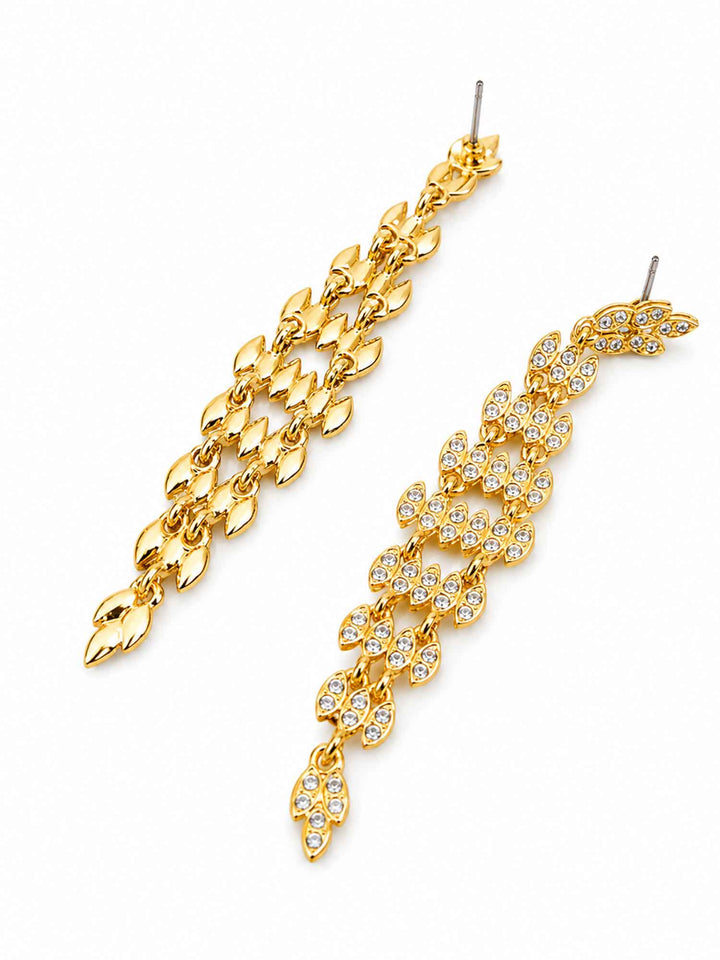 Side detail of Adele gold crystal statement drop earrings with clear crystals
