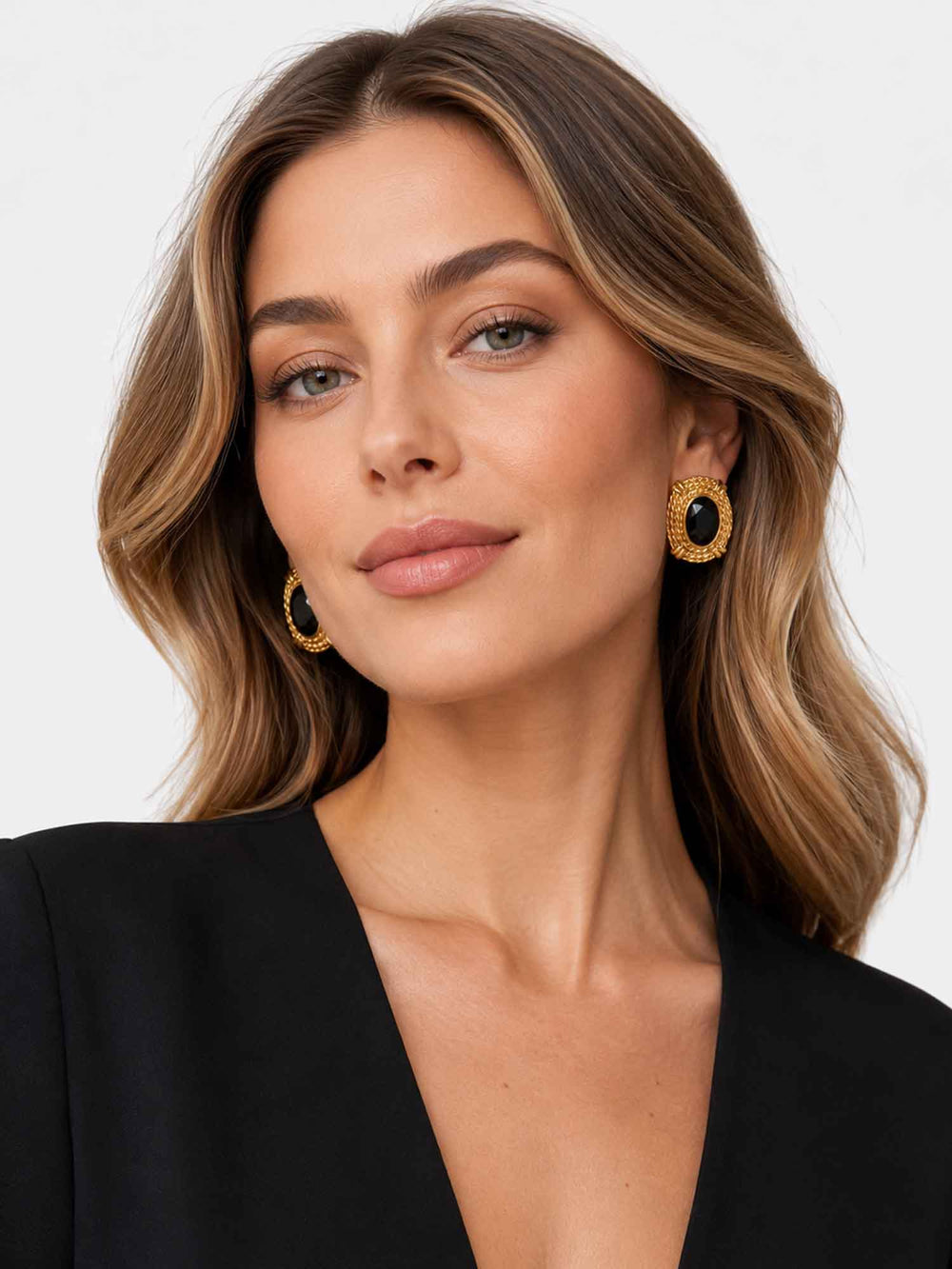 Model wearing Atenea black glass statement earrings with evening styling