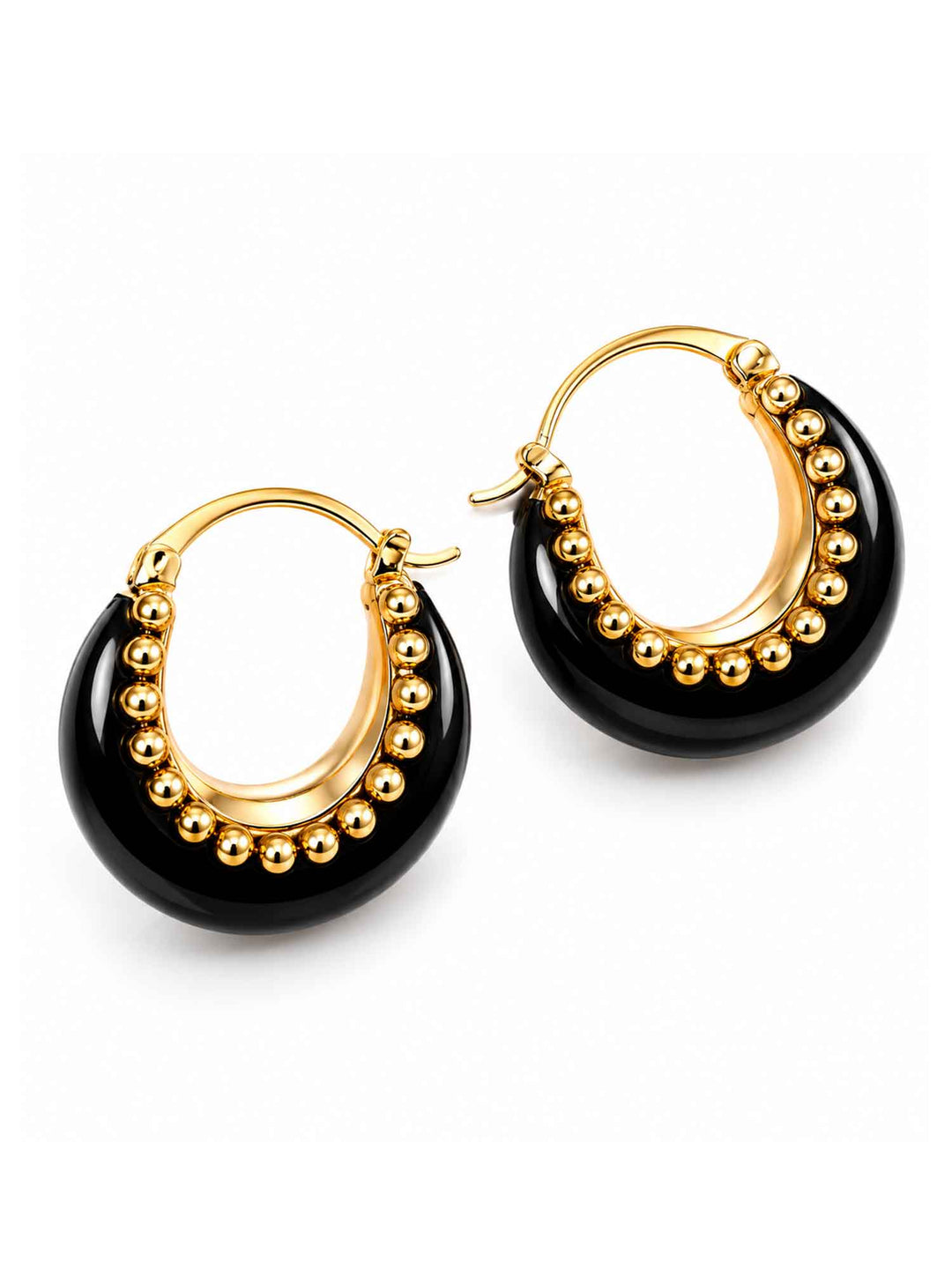 Pair of Brina black and gold hoop earrings on white background