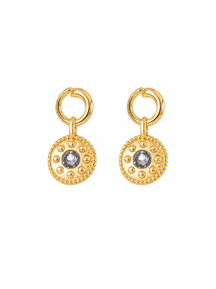 Pair of Celandine reversible black agate gold drop earrings on white background