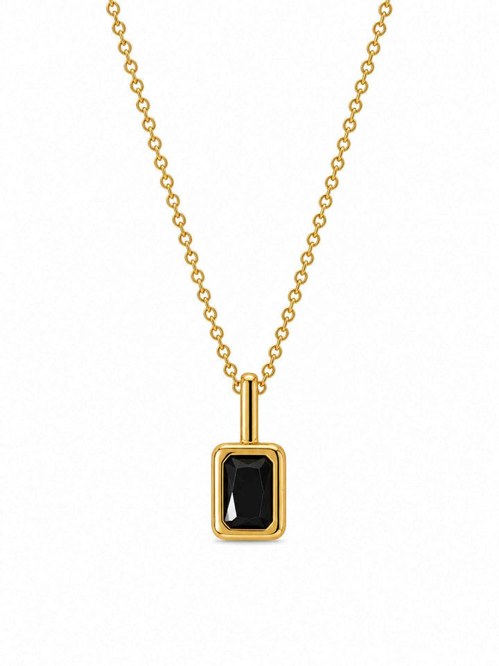 Clelia black cubic zirconia gold pendant necklace on white background
