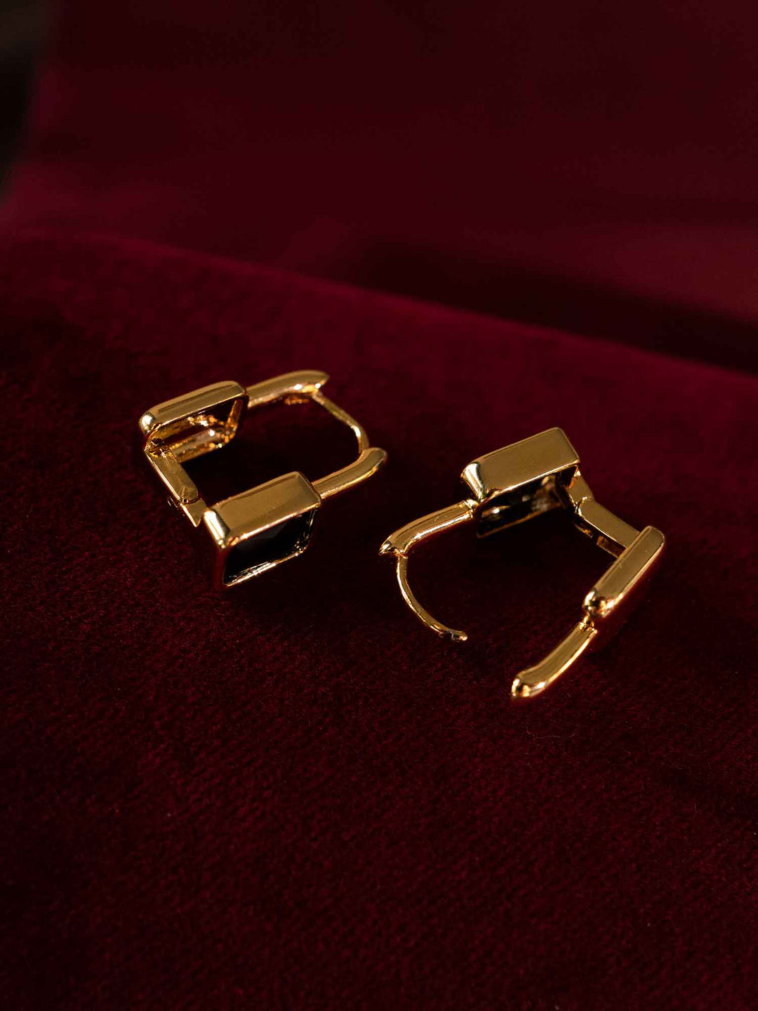Back view of Clelia black cubic zirconia hoop earrings with gold-plated