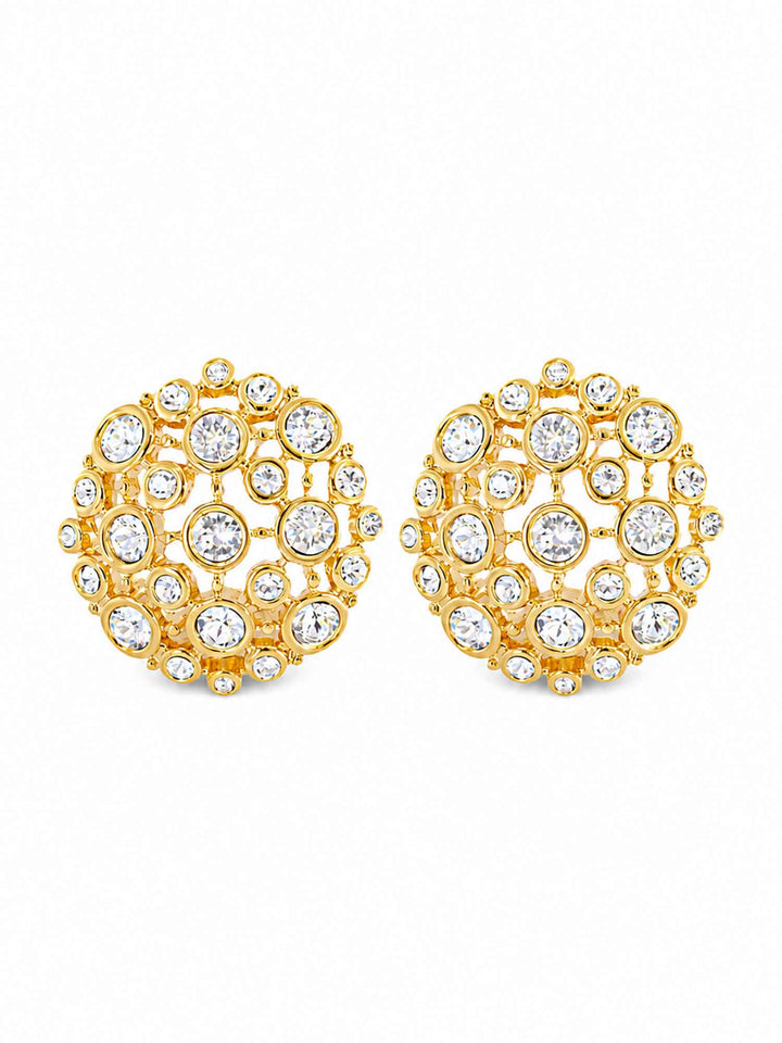Pair of Corisande gold cubic zirconia statement earrings on white background
